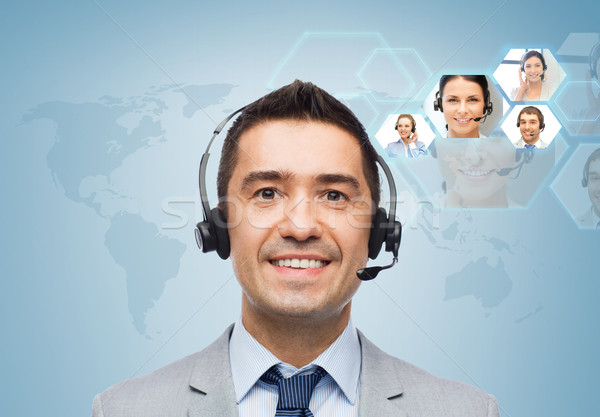smiling businessman in headset Stock photo © dolgachov