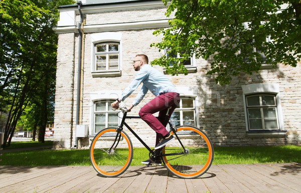 Heureux jeunes homme équitation fixé [[stock_photo]] © dolgachov