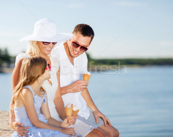 Stock photo: happy family eating ice cream