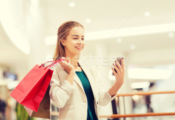 Сток-фото: женщину · смартфон · торговых · продажи