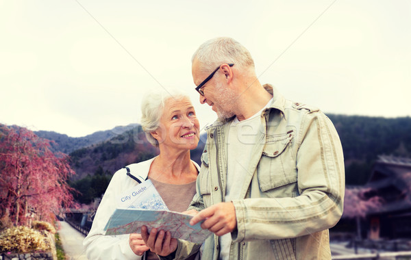 senior couple on city street Stock photo © dolgachov