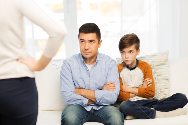 upset or displeased father, son and mother at home Stock photo © dolgachov