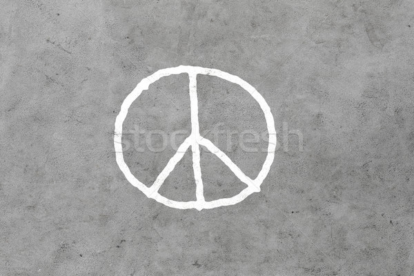 peace sign drawing on gray concrete wall Stock photo © dolgachov