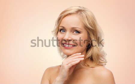 улыбающаяся женщина голый Плечи прикасаться лице красоту Сток-фото © dolgachov