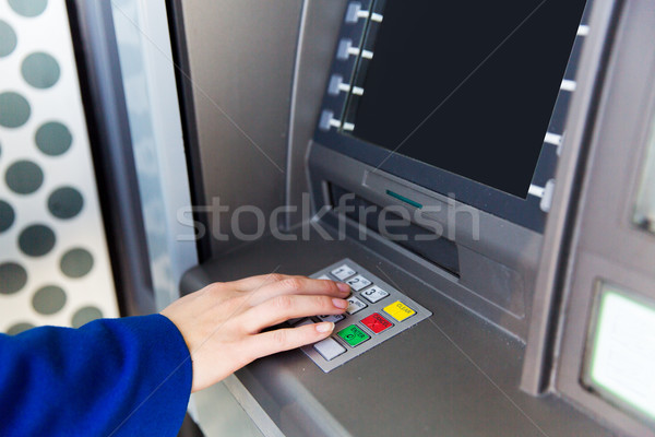 close up of hand entering pin code at cash machine Stock photo © dolgachov