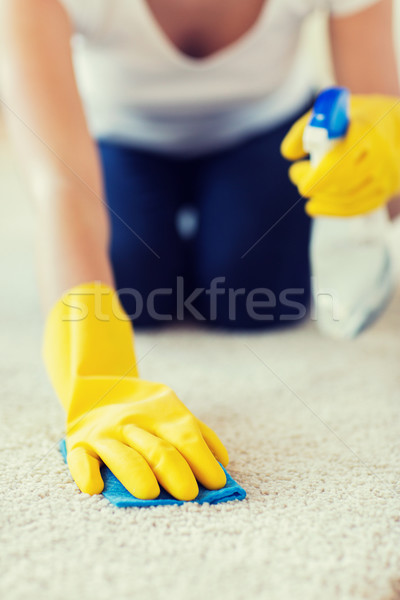 close up of woman with cloth cleaning carpet Stock photo © dolgachov