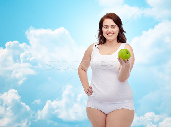 Stock photo: happy plus size woman in underwear with apple
