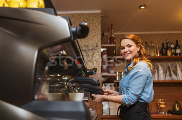 barista woman making coffee by machine at cafe Stock photo © dolgachov