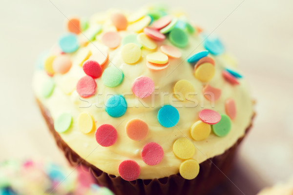 close up of glazed cupcake or muffin on table Stock photo © dolgachov