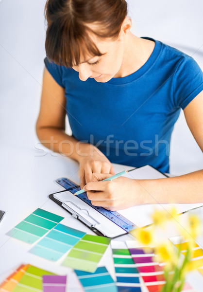 woman working with color samples for selection Stock photo © dolgachov