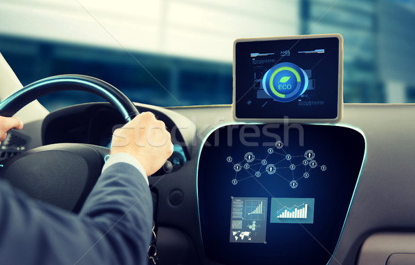 close up of man with tablet pc driving car Stock photo © dolgachov