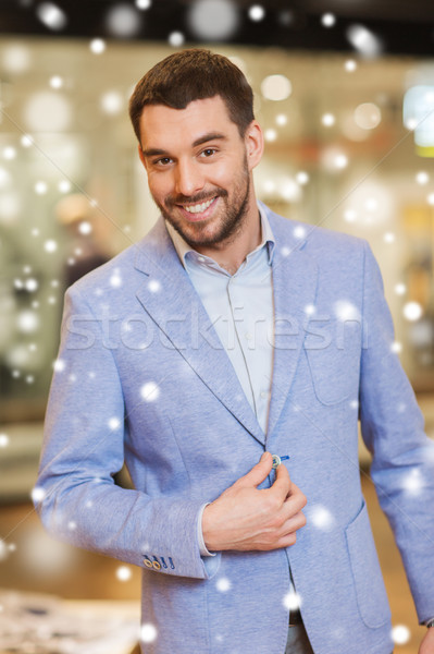 Heureux jeune homme veste vêtements magasin vente [[stock_photo]] © dolgachov