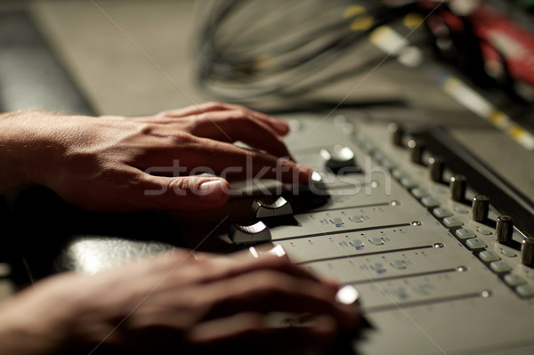 hands on mixing console in music recording studio Stock photo © dolgachov