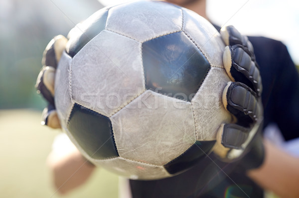 close up of goalkeeper with ball playing football Stock photo © dolgachov