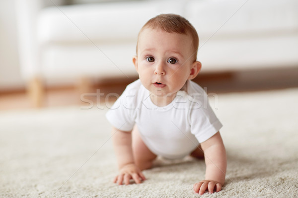 Little Baby In Diaper Crawling On Floor At Home Stock Photo C Syda