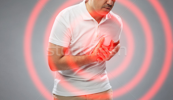 close up of man suffering from heart ache Stock photo © dolgachov