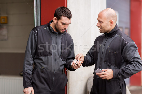 auto mechanics with cigarettes at smoking brake Stock photo © dolgachov
