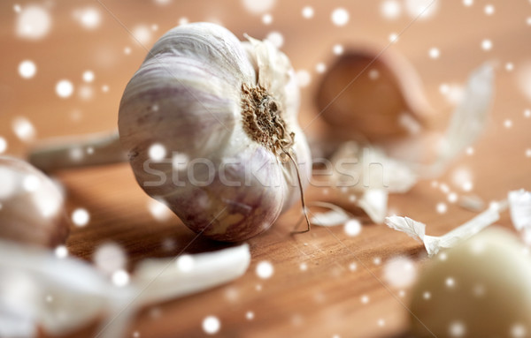 close up of garlic on wooden table Stock photo © dolgachov