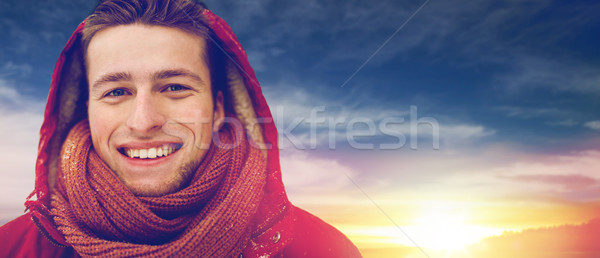 close up of happy man in winter jacket with hood Stock photo © dolgachov