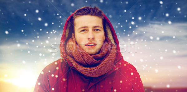 happy man in winter jacket with hood outdoors Stock photo © dolgachov