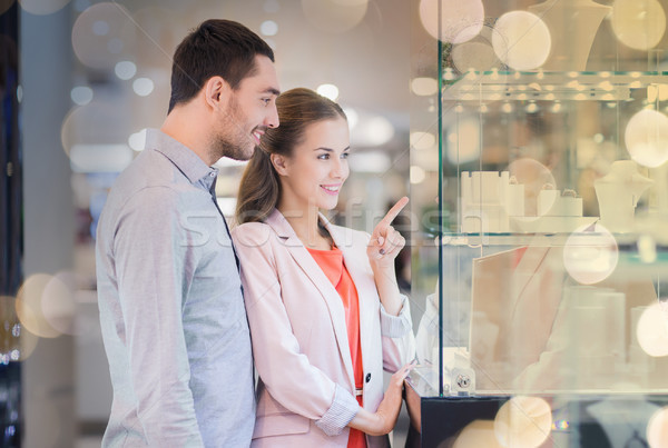 couple looking to shopping window at jewelry store Stock photo © dolgachov