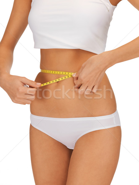 woman with measure tape Stock photo © dolgachov