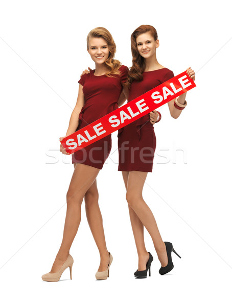 Adolescente vermelho vestidos venda assinar quadro Foto stock © dolgachov