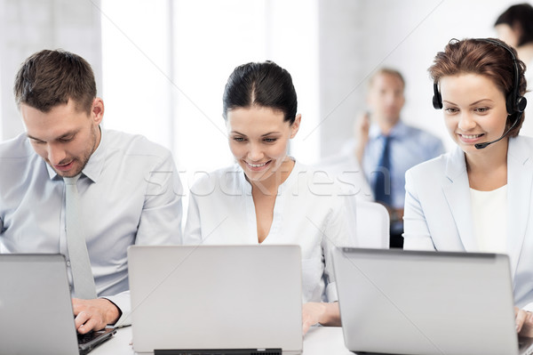 group of people working with laptops in office Stock photo © dolgachov