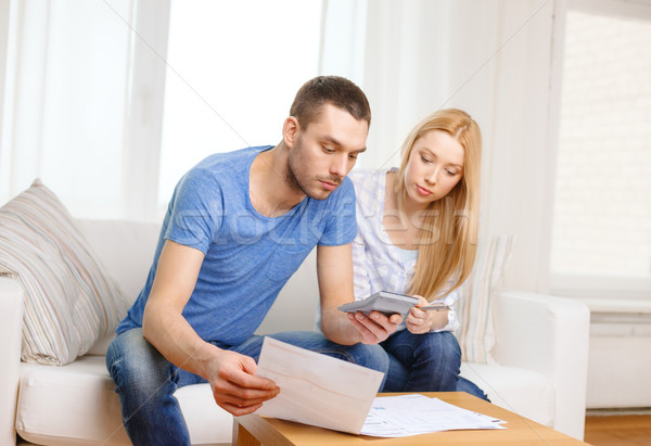 Occupés couple papiers simulateur maison impôt [[stock_photo]] © dolgachov