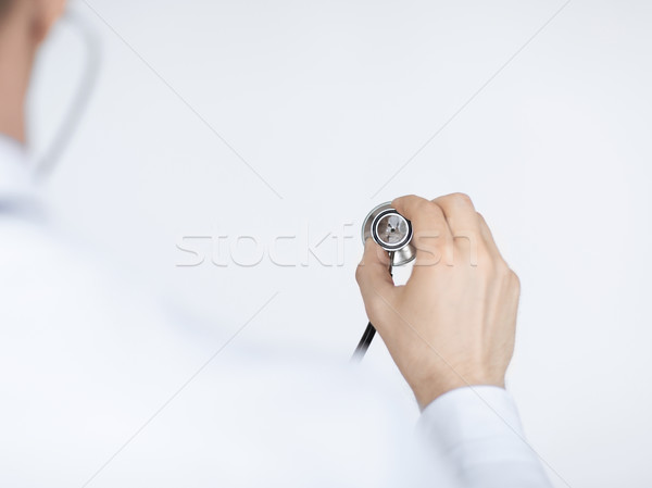 doctor hand with stethoscope listening somebody Stock photo © dolgachov