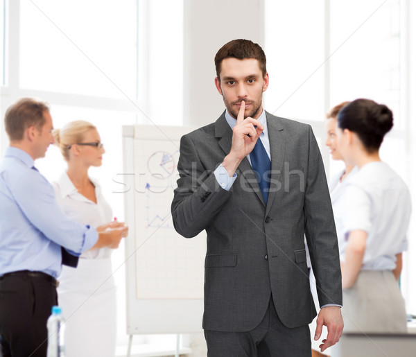 group of businessmen making hush sign Stock photo © dolgachov
