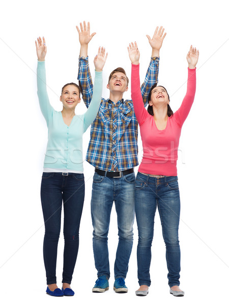 Grupo sorridente adolescentes as mãos levantadas amizade juventude Foto stock © dolgachov