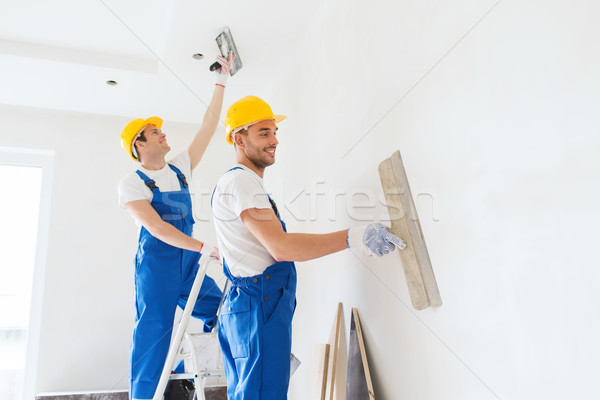 Stock photo: group of builders with tools indoors