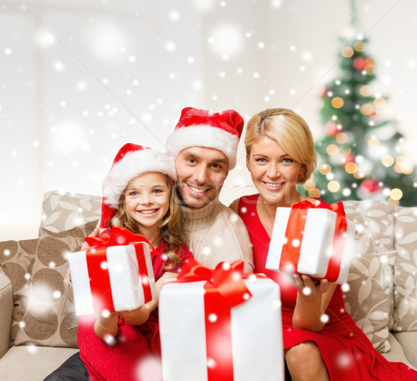 smiling family holding many gift boxes Stock photo © dolgachov