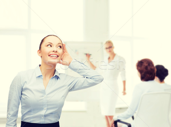 笑みを浮かべて 女性実業家 リスニング ビジネス オフィス ゴシップ ストックフォト © dolgachov