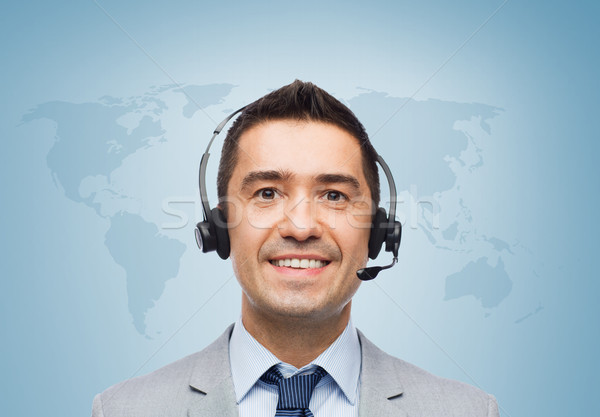 smiling businessman in headset Stock photo © dolgachov
