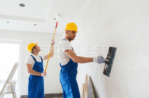 Stock photo: group of builders with tools indoors