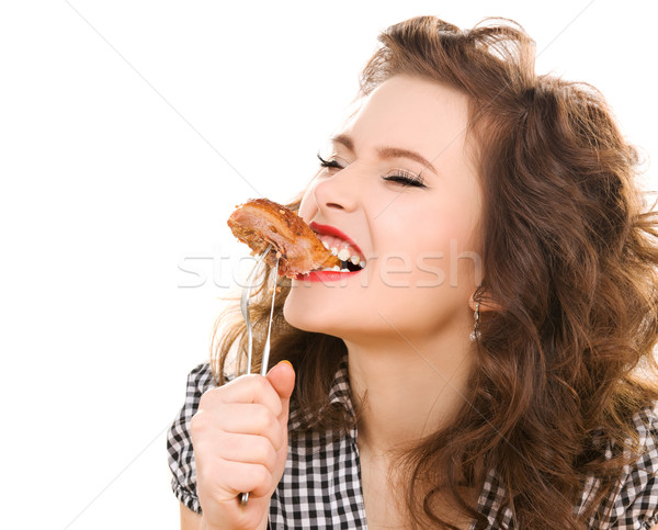 Paleo diéta nő eszik hús fiatal nő Stock fotó © dolgachov