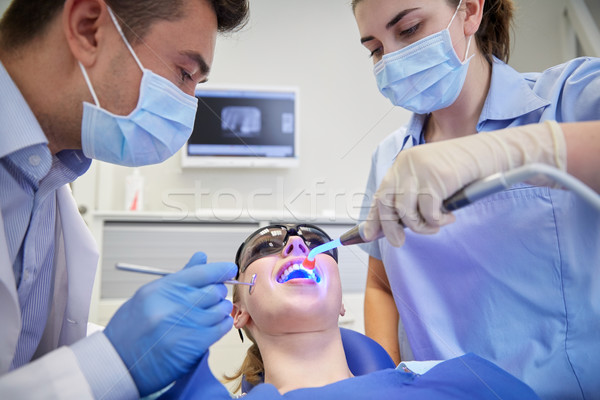 Dentistas mulher paciente dentes clínica pessoas Foto stock © dolgachov