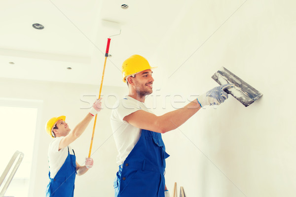 group of builders with tools indoors Stock photo © dolgachov