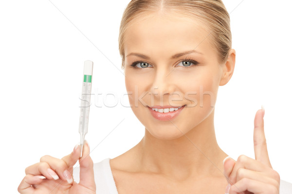 Atrakcyjna kobieta lekarza termometr zdjęcie kobieta szczęśliwy Zdjęcia stock © dolgachov