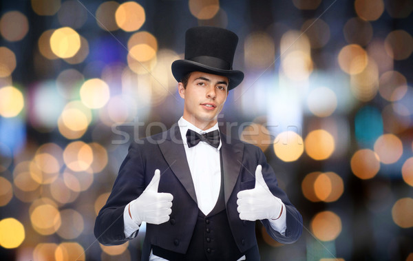 magician in top hat showing thumbs up Stock photo © dolgachov
