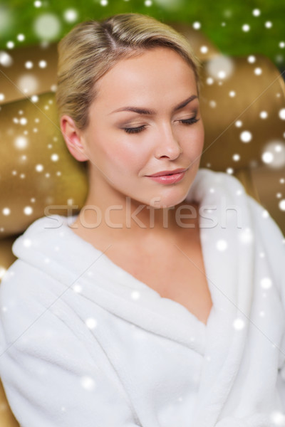 close up of woman sitting in bath robe at spa Stock photo © dolgachov