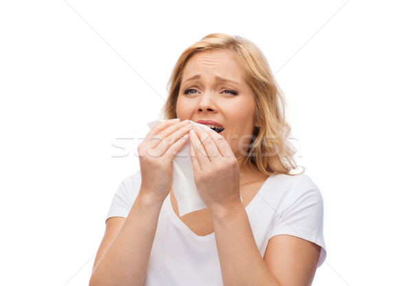 unhappy woman with paper napkin sneezing Stock photo © dolgachov