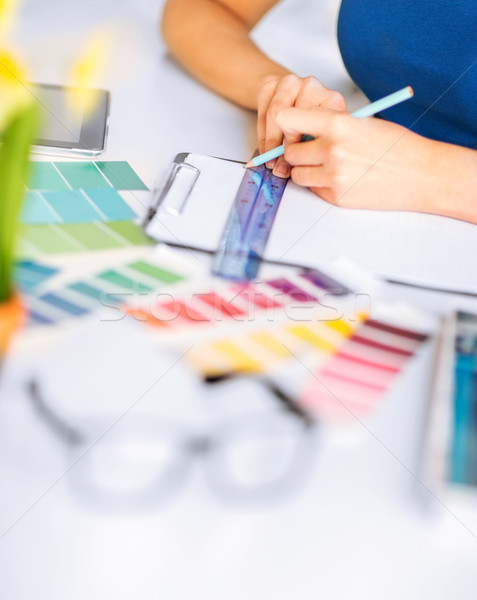 woman working with color samples for selection Stock photo © dolgachov