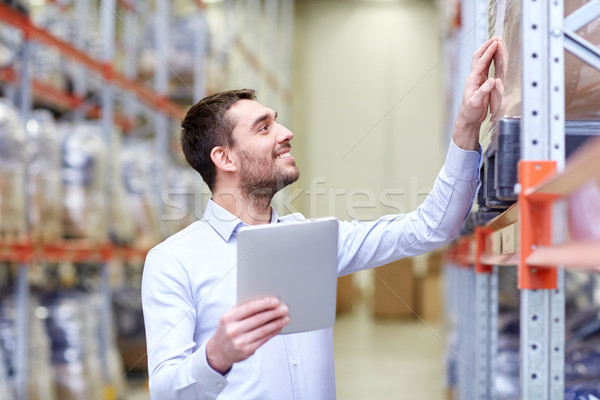 Boldog üzletember táblagép raktár nagybani eladás üzlet Stock fotó © dolgachov
