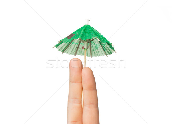 close up of two fingers with cocktail umbrella Stock photo © dolgachov