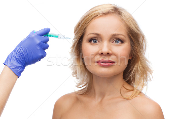 Gelukkig vrouw gezicht hand spuit schoonheid cosmetische chirurgie Stockfoto © dolgachov