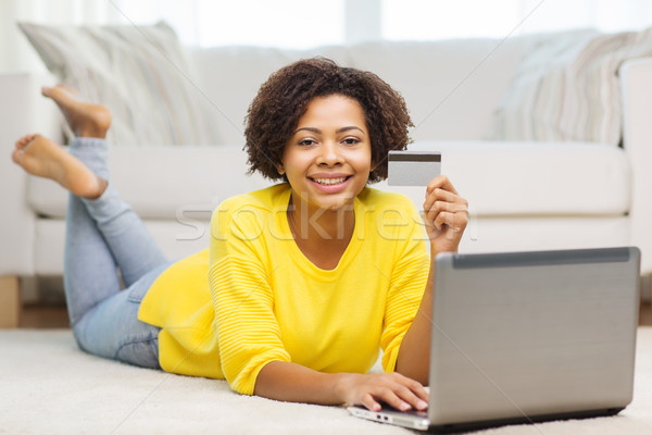 happy african woman with laptop and credit card Stock photo © dolgachov