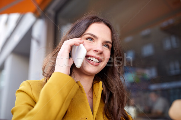 smiling young woman or girl calling on smartphone Stock photo © dolgachov